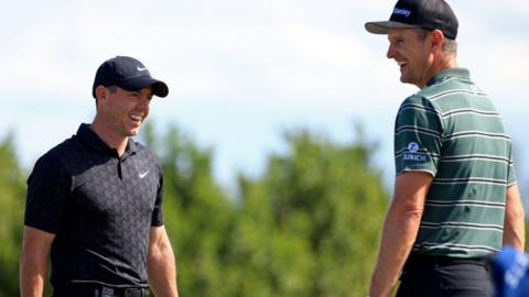 Rory McIlroy of Northern Ireland and Justin Rose of England