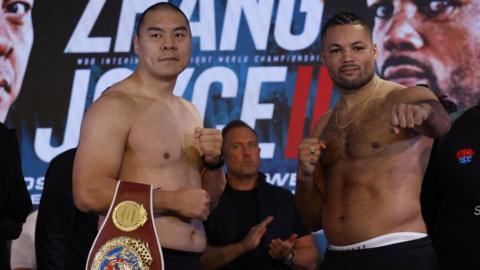 Joe Joyce and Zhilei Zhang pose for cameras at the weigh-in