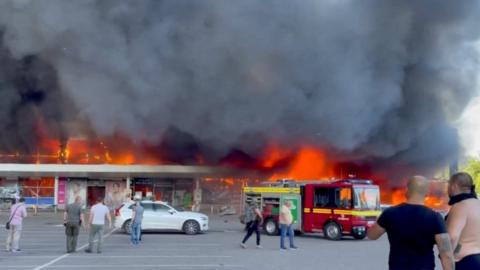 Flames engulfing the mall in Kremenchuk
