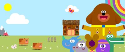 Hey Duggee and the squirrels with the hut, animals and a rainbow in the background.