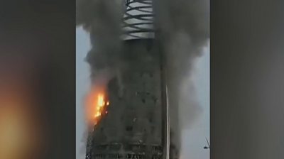 The Greater Nile Petroleum Oil Company Tower in Khartoum on fire