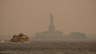 A haze blankets the Statue of Liberty