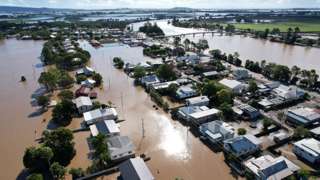An aerial drone view of houses inundated by floodwater on March 07, 2022 in Woodburn, Australia