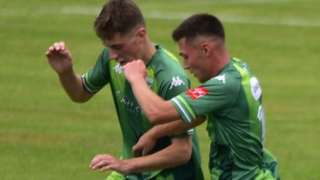 Guernsey FC players go for the ball