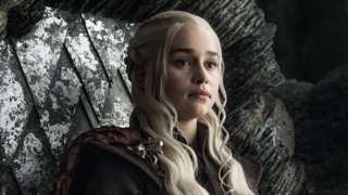 Emilia Clarke as Daenerys Targaryen - a woman with blonde hair in a medieval fantasy setting