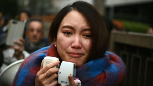 Japanese journalist Shiori Ito sheds a tear as she speaks to reporters outside the Tokyo district court on December 18, 2019 after hearing the ruling on a damages lawsuit by her, accusing a former TV reporter of rape