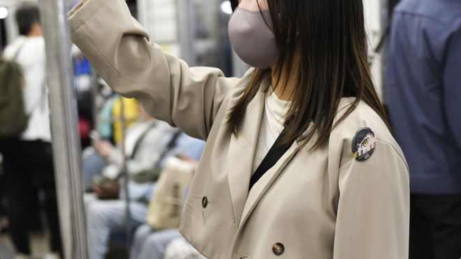Woman in mask on Japanese train