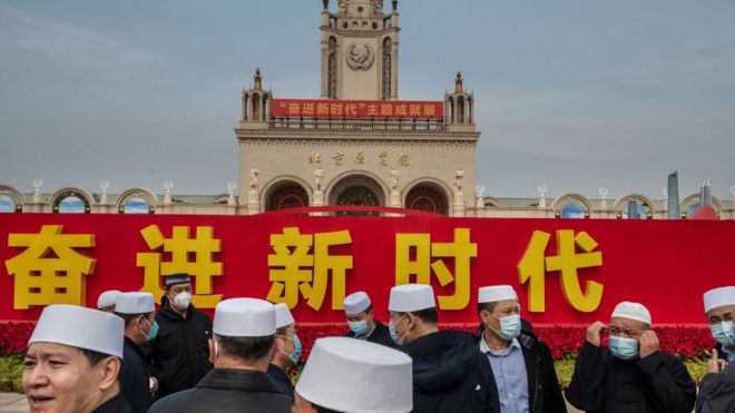 Party members from the Hui Muslim minority stand together at an exhibition highlighting Chinese President Xi Jinping's years as leader, as part of the upcoming 20th Party Congress, on October 12, 2022 in Beijing, China.