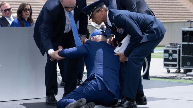Joe Biden is helped up after he falls