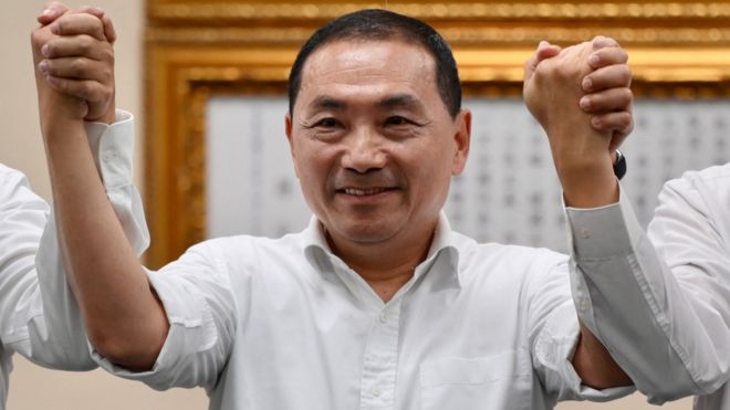 Mayor of New Taipei City Hou Yu-ih gestures after he was selected to be the 2024 presidential candidate for the main opposition Kuomintang (KMT) party during a press conference in Taipei on May 17, 2023.