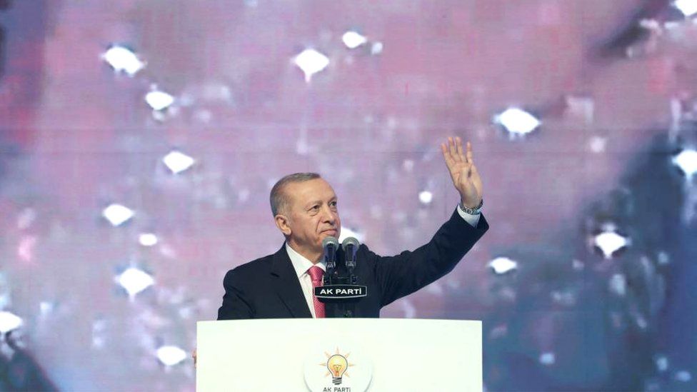 Turkish President Tayyip Erdogan greets the audience during a meeting of his ruling AK Party to announce the party's election manifesto ahead of the May 14 elections, in Ankara, Turkey April 11, 2023