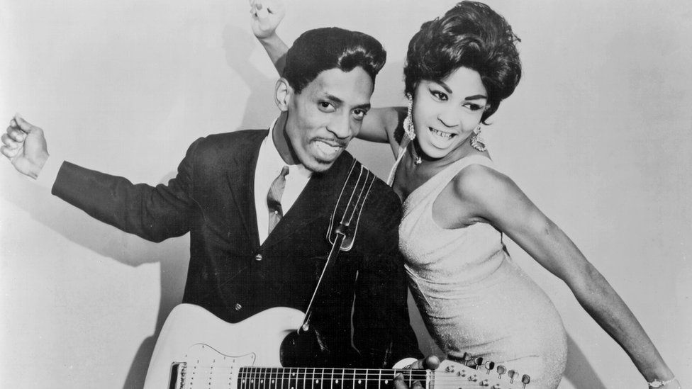 Ike and Tina Turner with a guitar