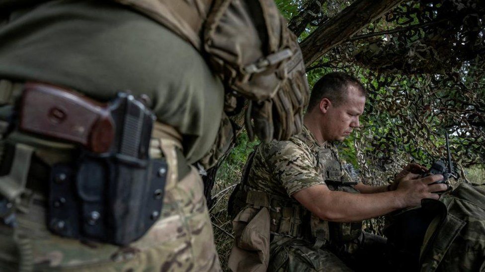 A Ukrainian serviceman operates an FPV drone from his positions at a front line, as Russia's attack on Ukraine continues, near the village of Robotyne, Zaporizhzhia region, Ukraine August 25, 2023.