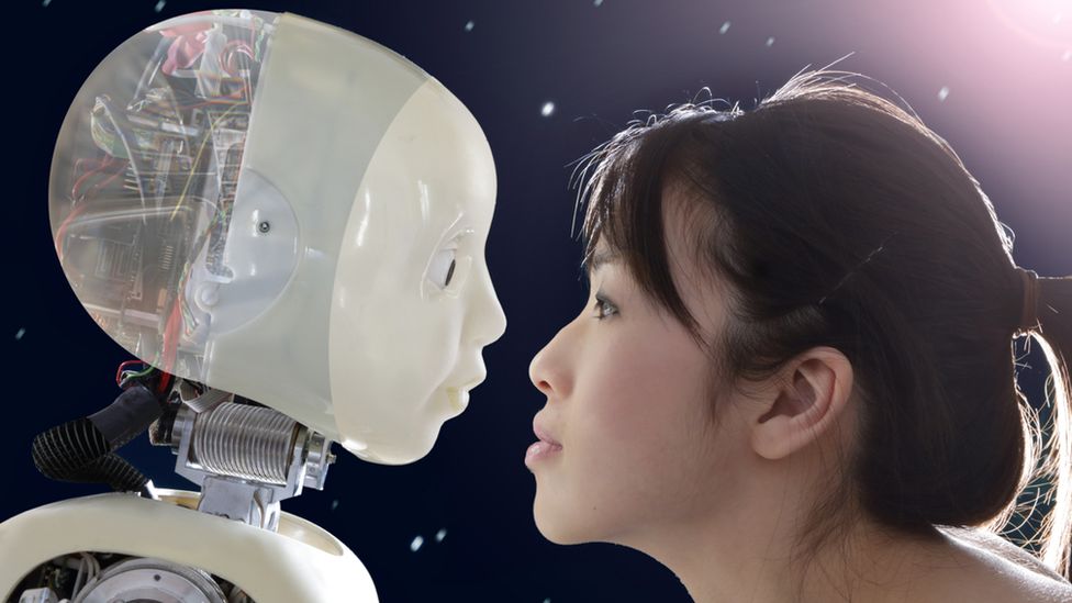 Woman faces robot