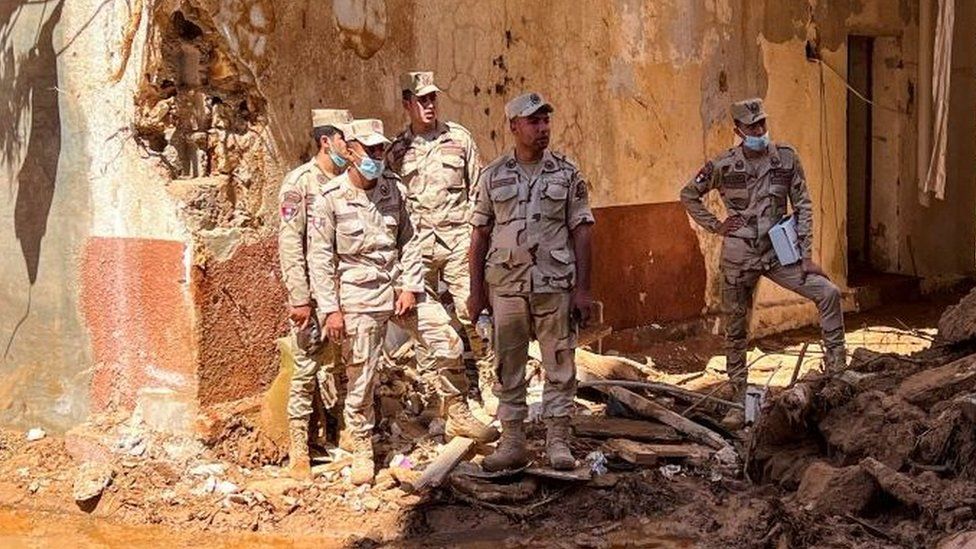 Members of the Egyptian army inspect the damage