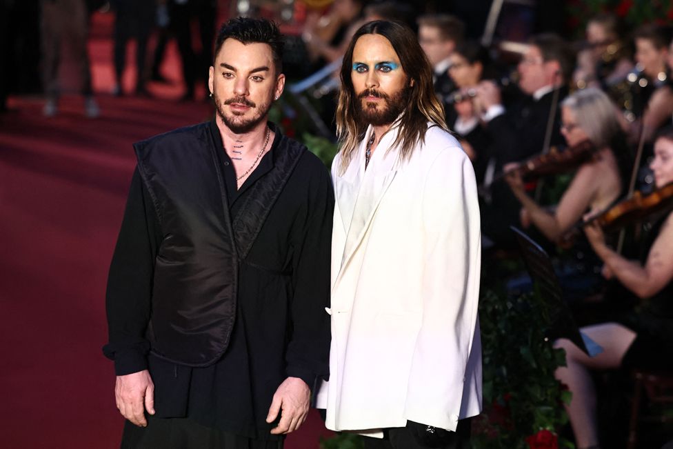 US actor and singer Jared Leto (R) and US drummer Shannon Leto of Thirty Seconds to Mars pose for photos at Vogue London event
