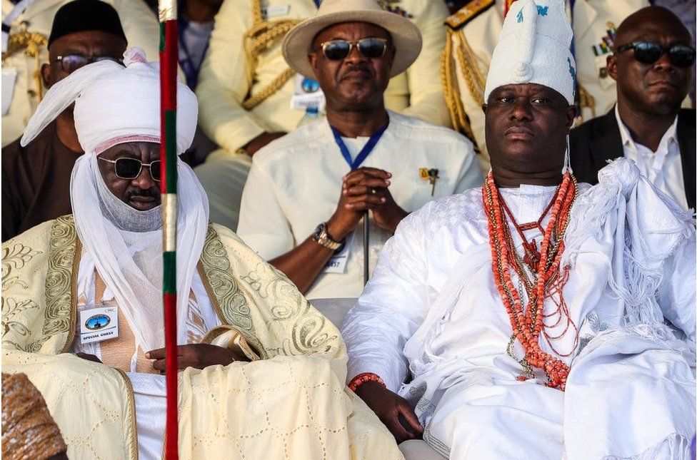 The Sultan of Kano and the Ooni of Ife dressed in white traditional clothes.